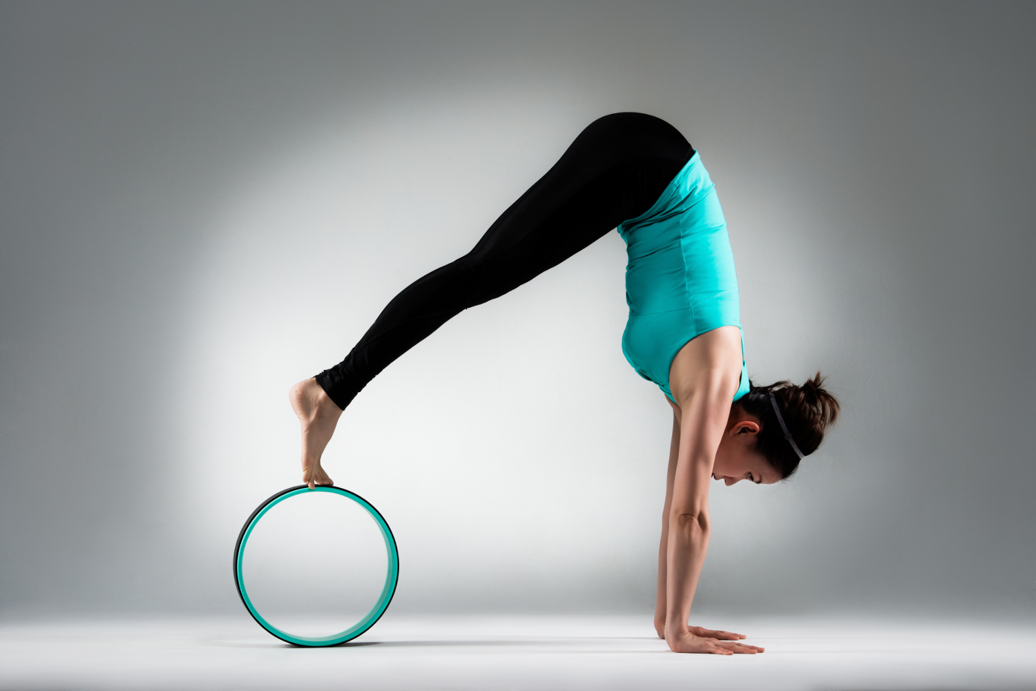Student using Pilates wheel